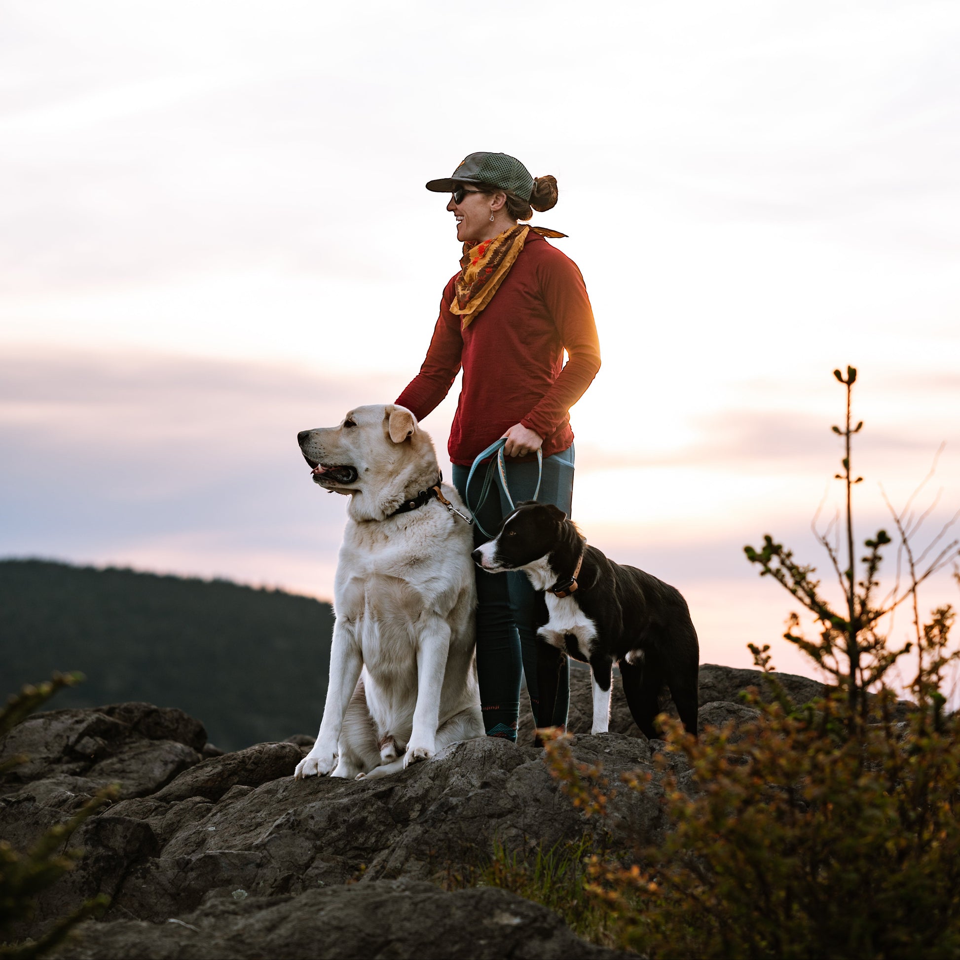 Woman hiking with tso dogs and hands free leash