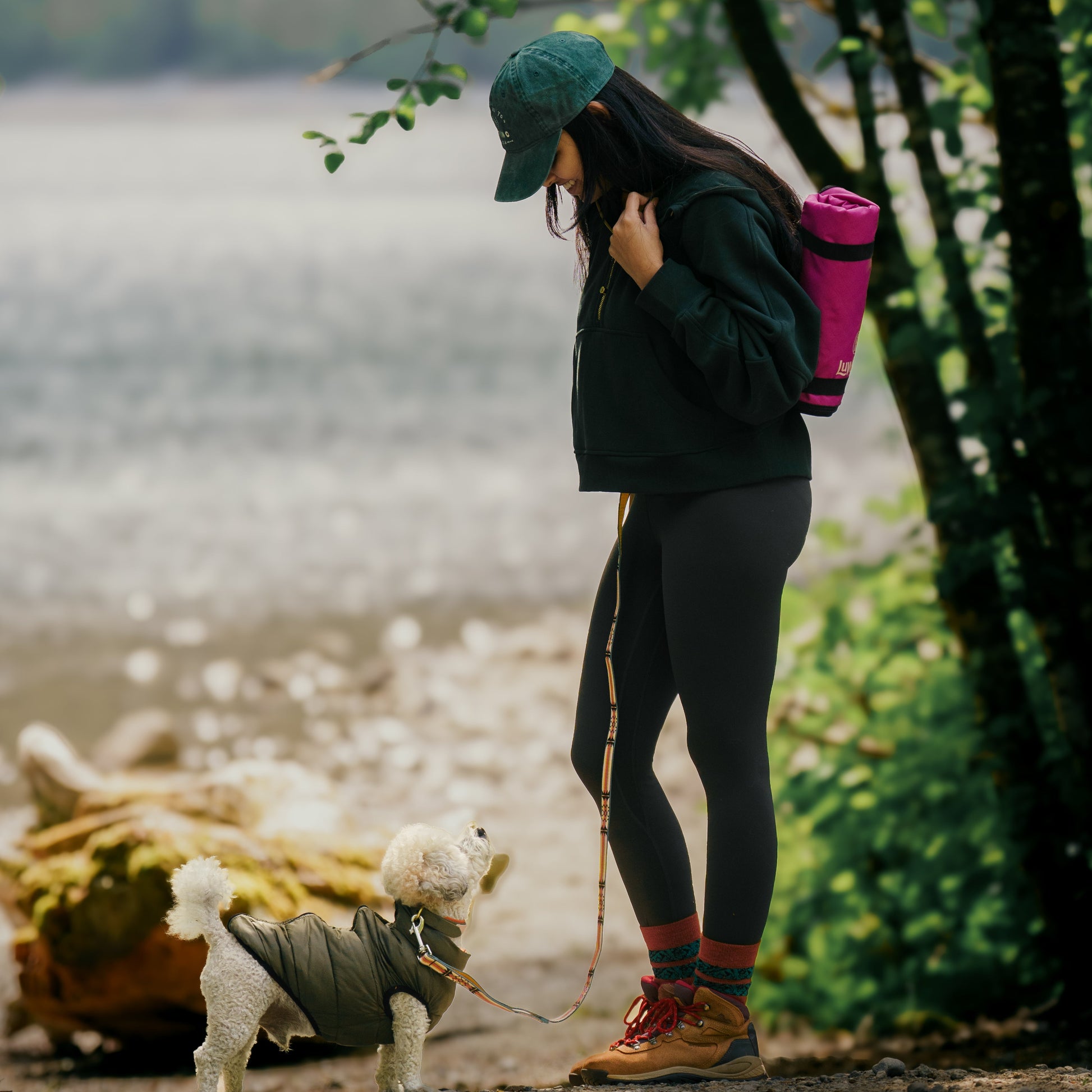 Bichon Frise and her mom hiking with hands free leash and lightweight hiking mat